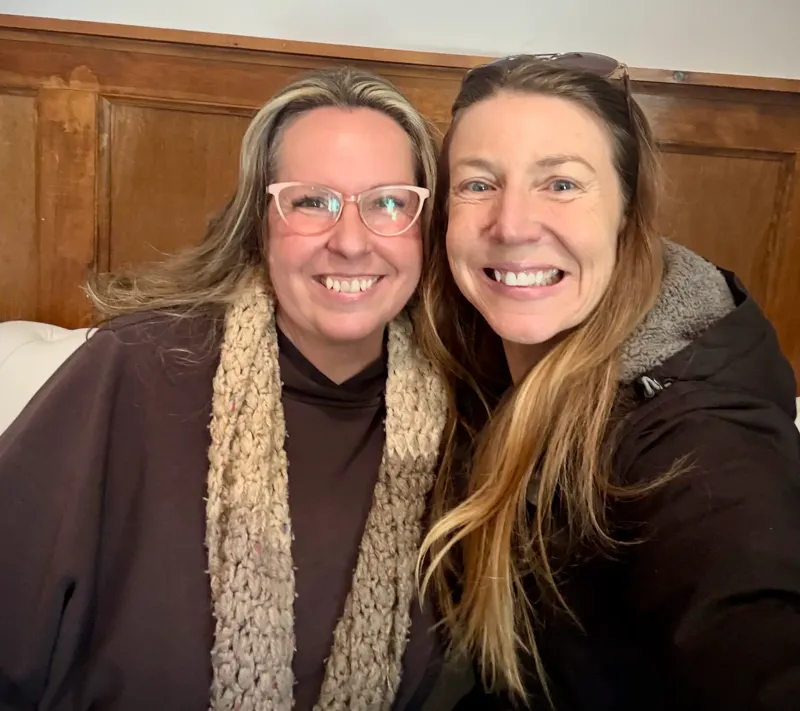 Two Nanaimo members smiling together after their coffee